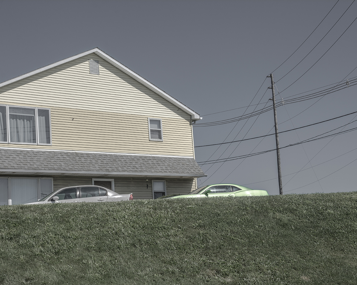 A Yellow House and a Lime Green Car