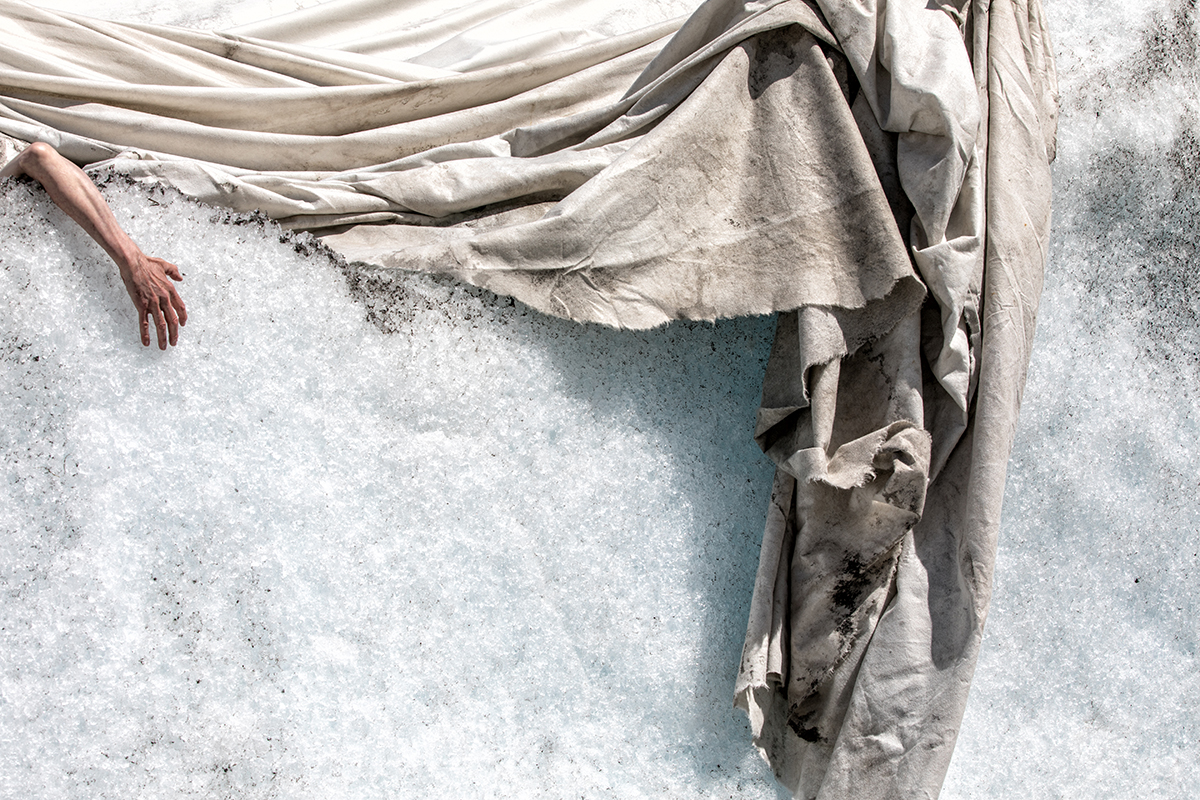 Climate Change - Hand Desperately Grasping Melting Ice