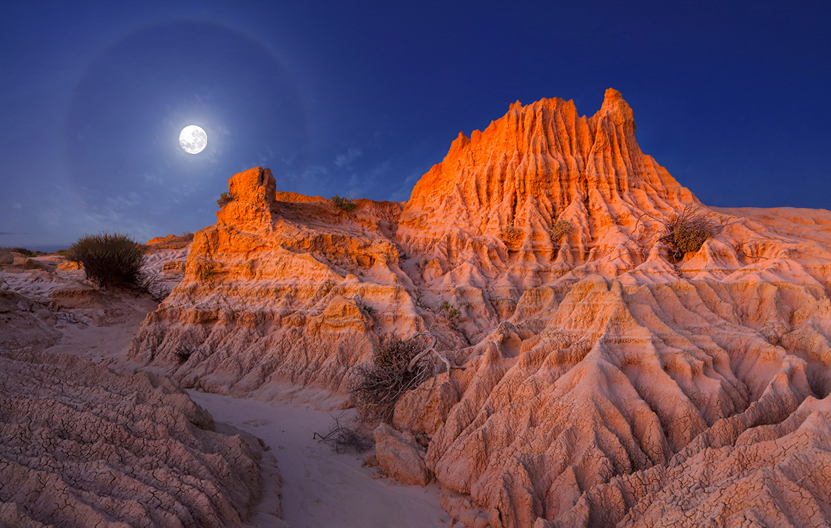 Glory Moon over Lunar Landscape