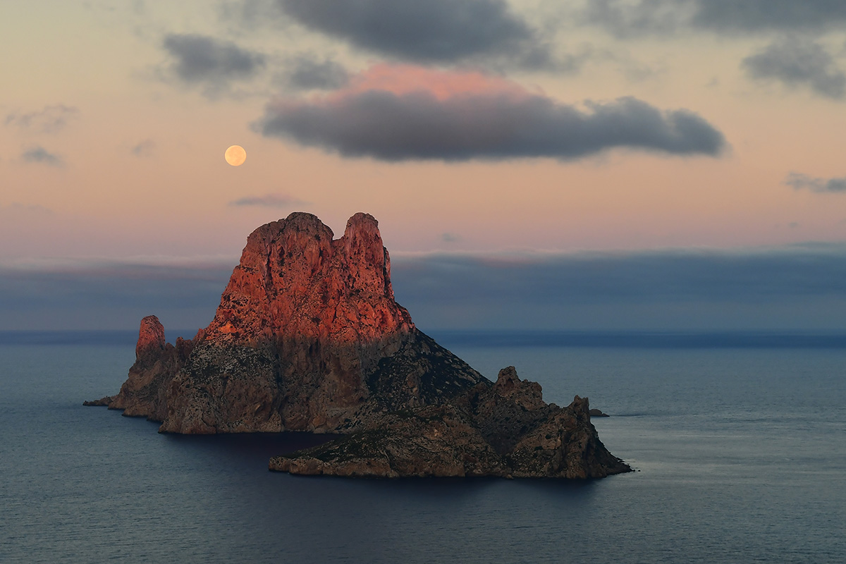 Sunrise and full moon