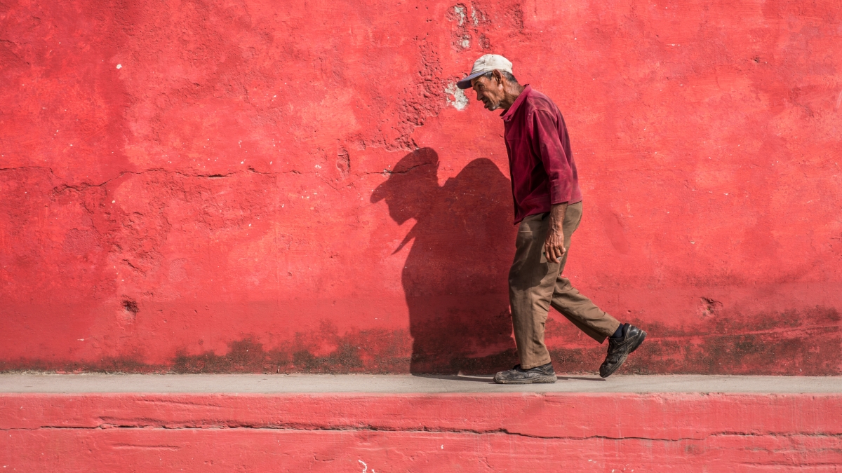 An old man walking in the streets of Cuba 