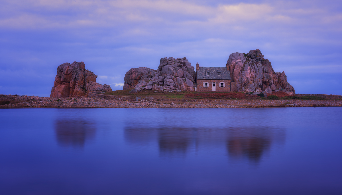 house between rocks