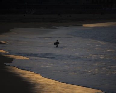 Bodyboarder at sunset.