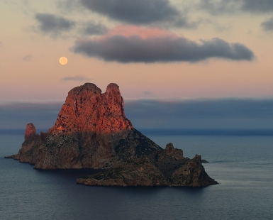 Sunrise and full moon