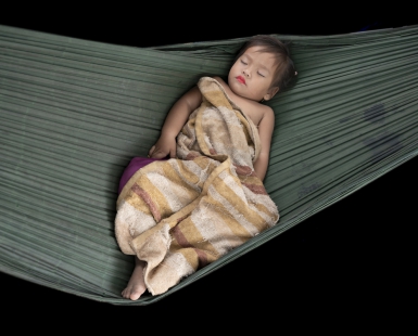 Sleeping girl in hammock