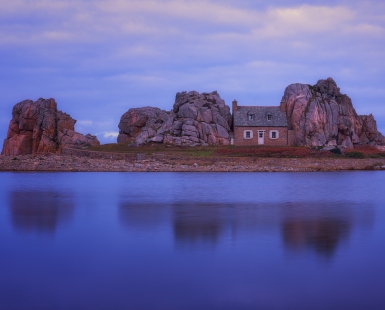 house between rocks