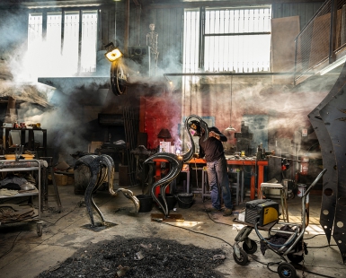Iron worker in his workshop