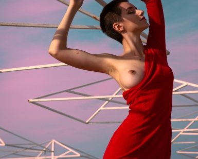 Black sea and girl in a red dress